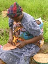 Basket weaver with child in Swaziland