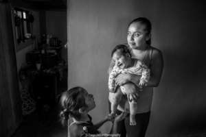 Otomi partner and her children in her home