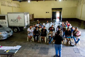 Nurse Alexia talks to patients in Alotenango