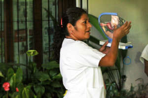 Rosy explaining cervical cancer at a mobile clinic