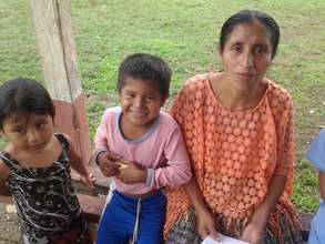 Woman waits with her children, Clinic in Raxruha