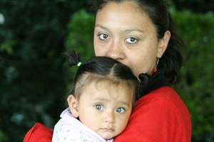 Ligia's 1 year old daughter waiting with her aunt