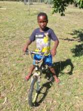 Our newest boy so happy riding a bike at Christmas