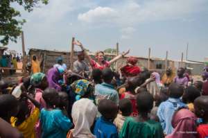 HTA singing with children at Wasa IDP settlement