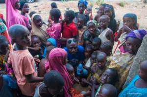 HTA with children at Waru settlement