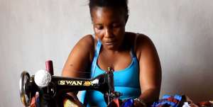 Mariama sews her special dress