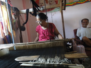 a weaving artisan with her husband