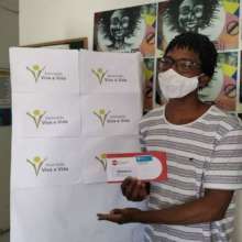 Young beneficiary receives a food voucher