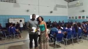 Juracy talks to night school students about work