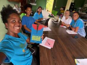 The team reading How to Be an Anti-Racist Educator