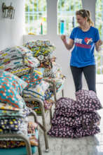 Nicole and stacks of cloth diaper kits!