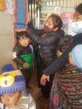 Cristina Weighing a Child