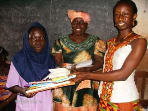 Student receiving scholarship and supplies