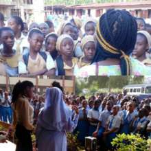 GCAF staff and volunteers talking with girls