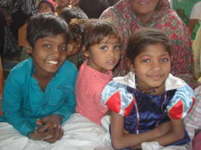 children excited to receive warm clothes