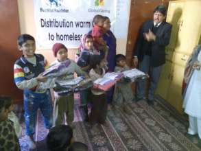 children received package of new warm clothes
