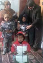 Distribution of warm clothes to children