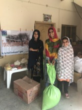 Orphan Girls with mother getting food