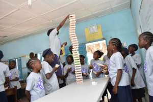 Kids in action building with Kiva blocks.