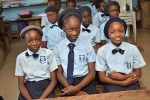 Our Girls in there classroom during our visit.