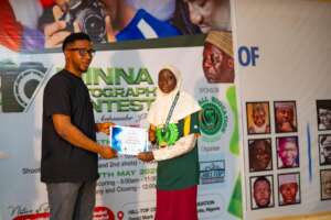 Hadiza  accepting her prize.