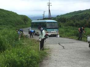 Grass cutting at public areas by volunteers
