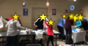 Guests and volunteers assembling kits!
