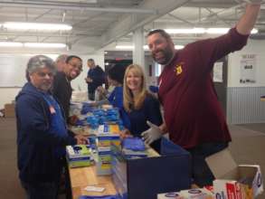 Ford Motor Company employees assembling kits