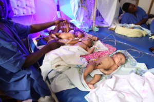 Infants sharing bed at Kachumabala Clinic, Uganda