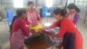 Women making Lapsi candy