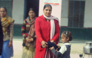 Distributed Woollen Dress to Needy Girl child