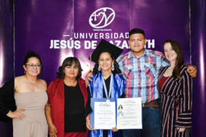 Heyli with family and OYE on her graduation day