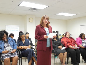 A woman shares her story at graduation