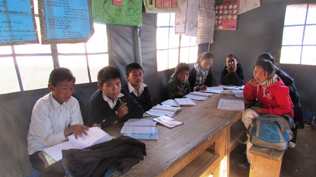 Building 10 classrooms for 500 students in Nepal.