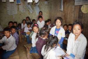 Children in Classroom without enough furniture