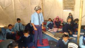 Children studying at temporary learning center