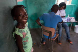 A young girl waits in line for a medical check-up