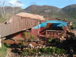 A home with a displaced roof in Beaumont, Haiti