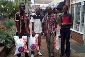 A few new students buying their school uniforms