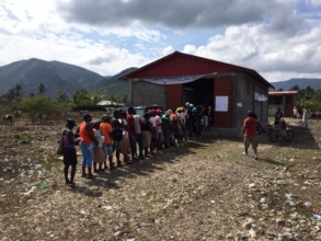 Community members gather to buy their seed
