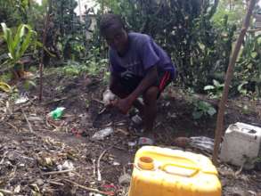 Maurice cleaning up his home garden