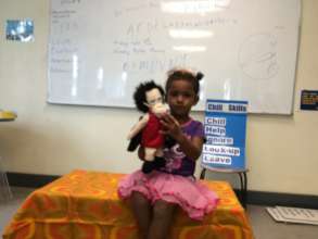 Child and puppet use Chill Skills in Lautoka, Fiji