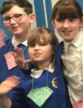 Kids sporting their Virtues Acknowledgment Cards
