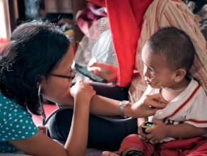 Nurse Ana checks Ivan's vital signs