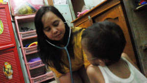 Sandi in the caring hands of Rachel House nurse