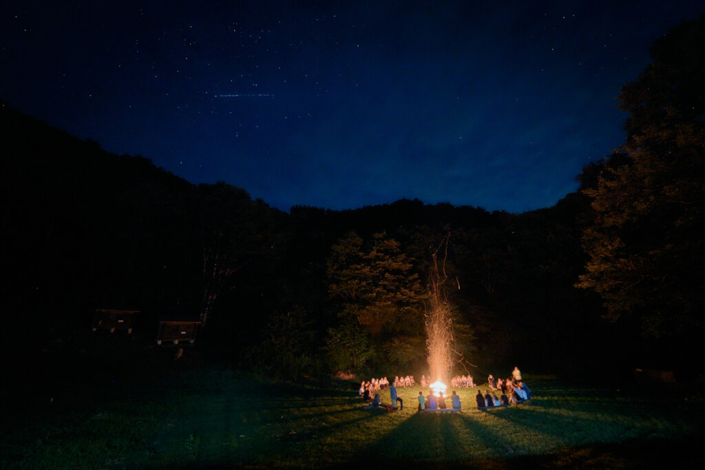 Campfire Reflections under the Stars