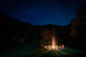 Campfire Reflections under the Stars