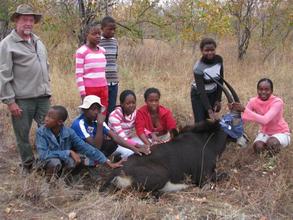 Children with a Sable Antelope