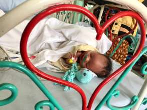 newborn baby on oxygen treated for pneumonia