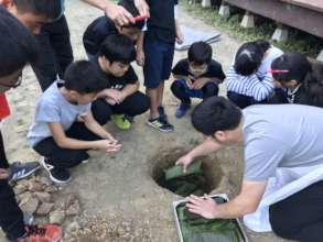 placing ingredients in a hole